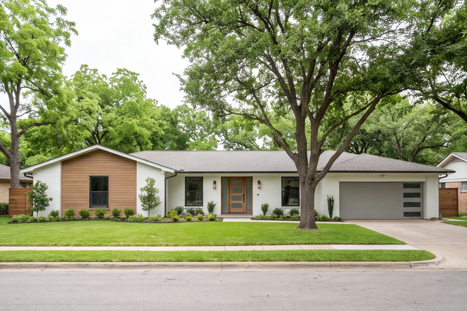 Front of a 1960s Lake Highlands ranch with new siding, wide entry and updated trim